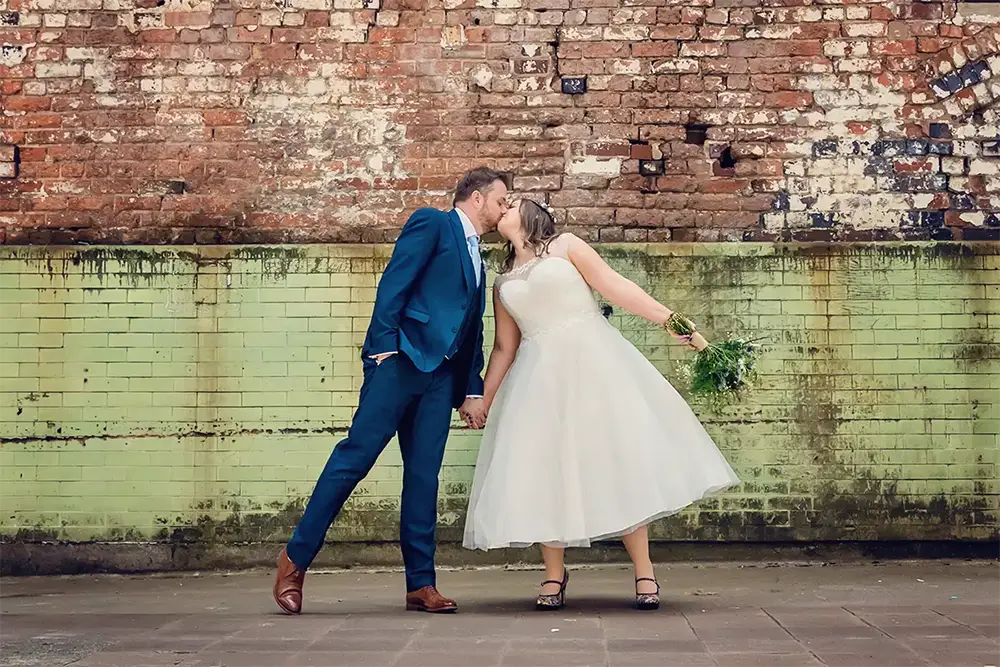 Newlyweds kissing after elopement in Worcester